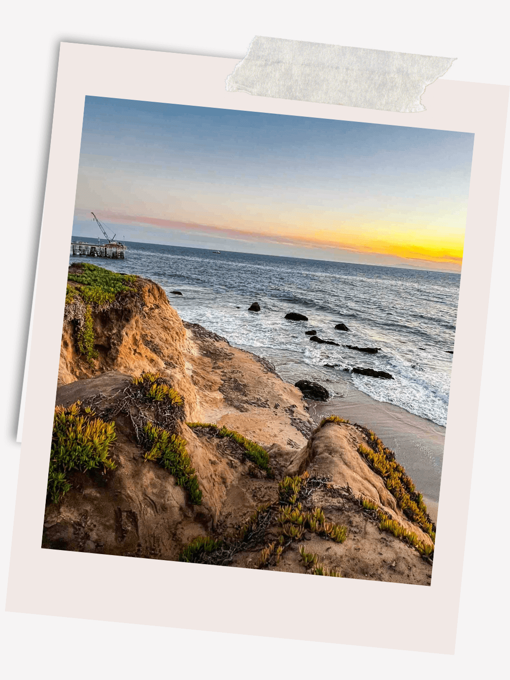 bluff top views of ocean from Carpinteria with yellow and orange sunset.