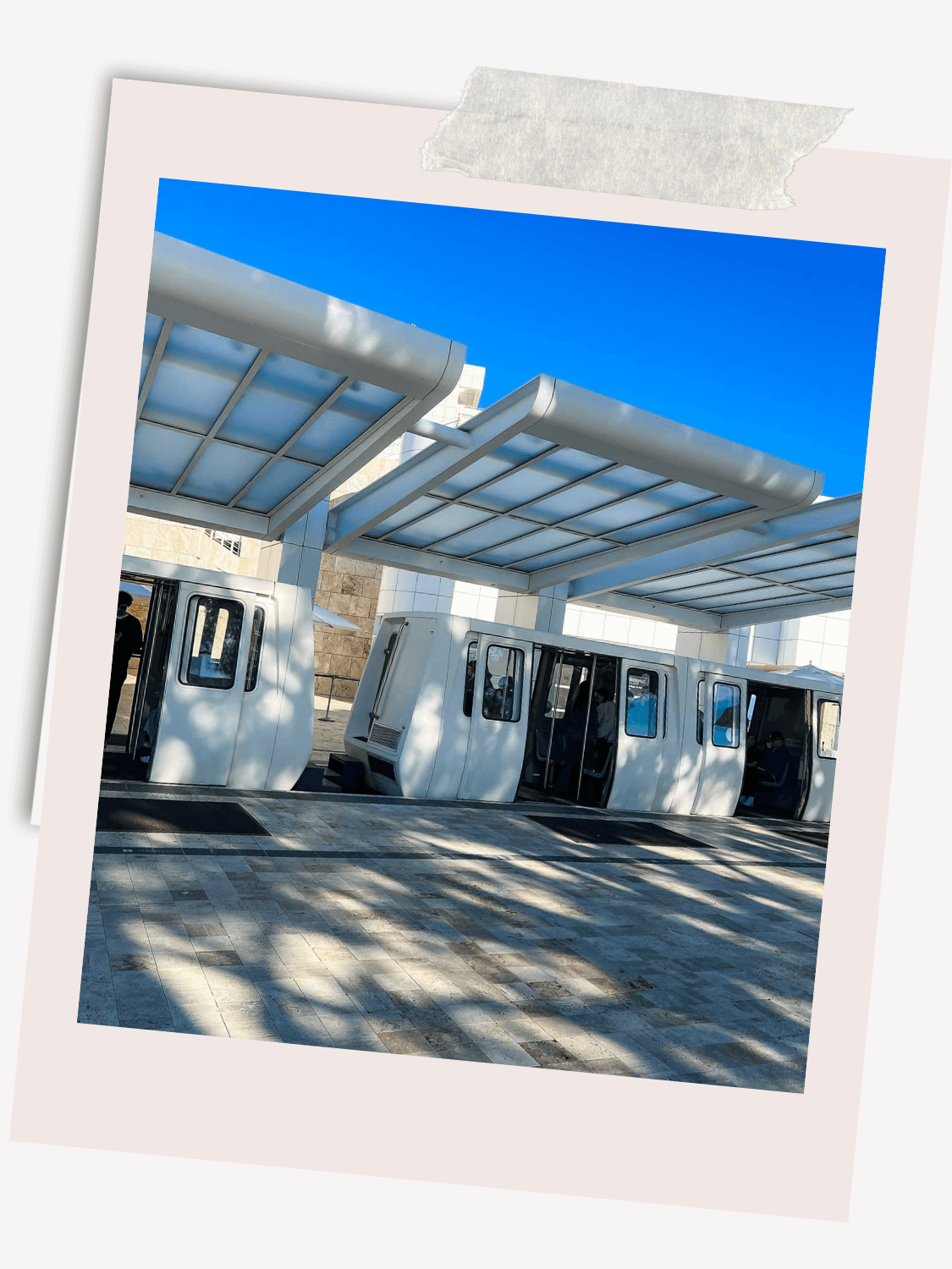 The Getty Center’s sleek tram offers visitors a scenic ride up the hill, providing a glimpse of the museum’s stunning architecture before arrival.